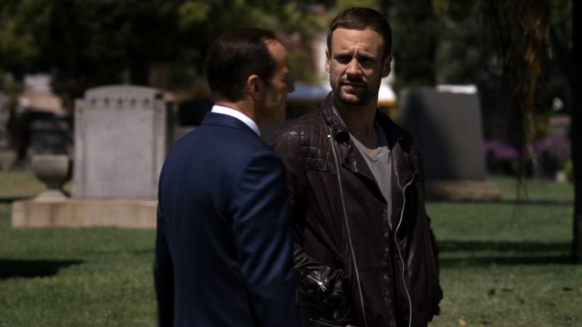Hunter and Coulson in cemetery.
