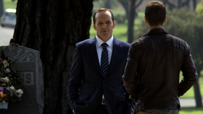Hunter and Coulson in cemetery.