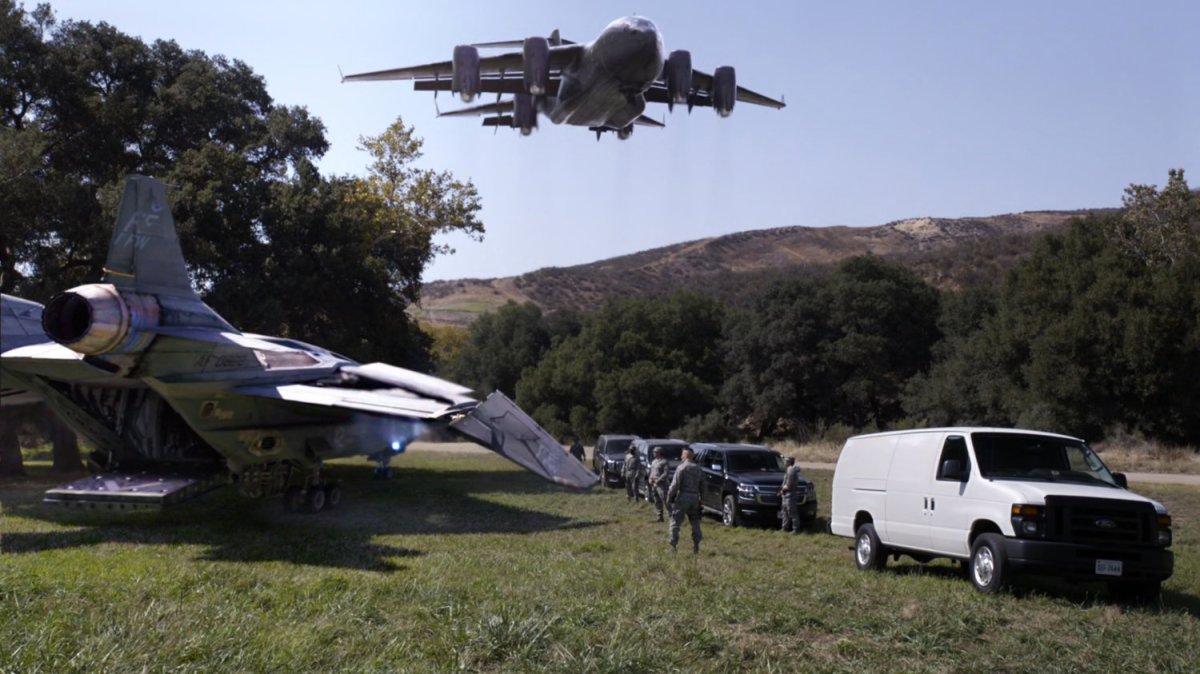 The Bus and quinjet materialize in field.
