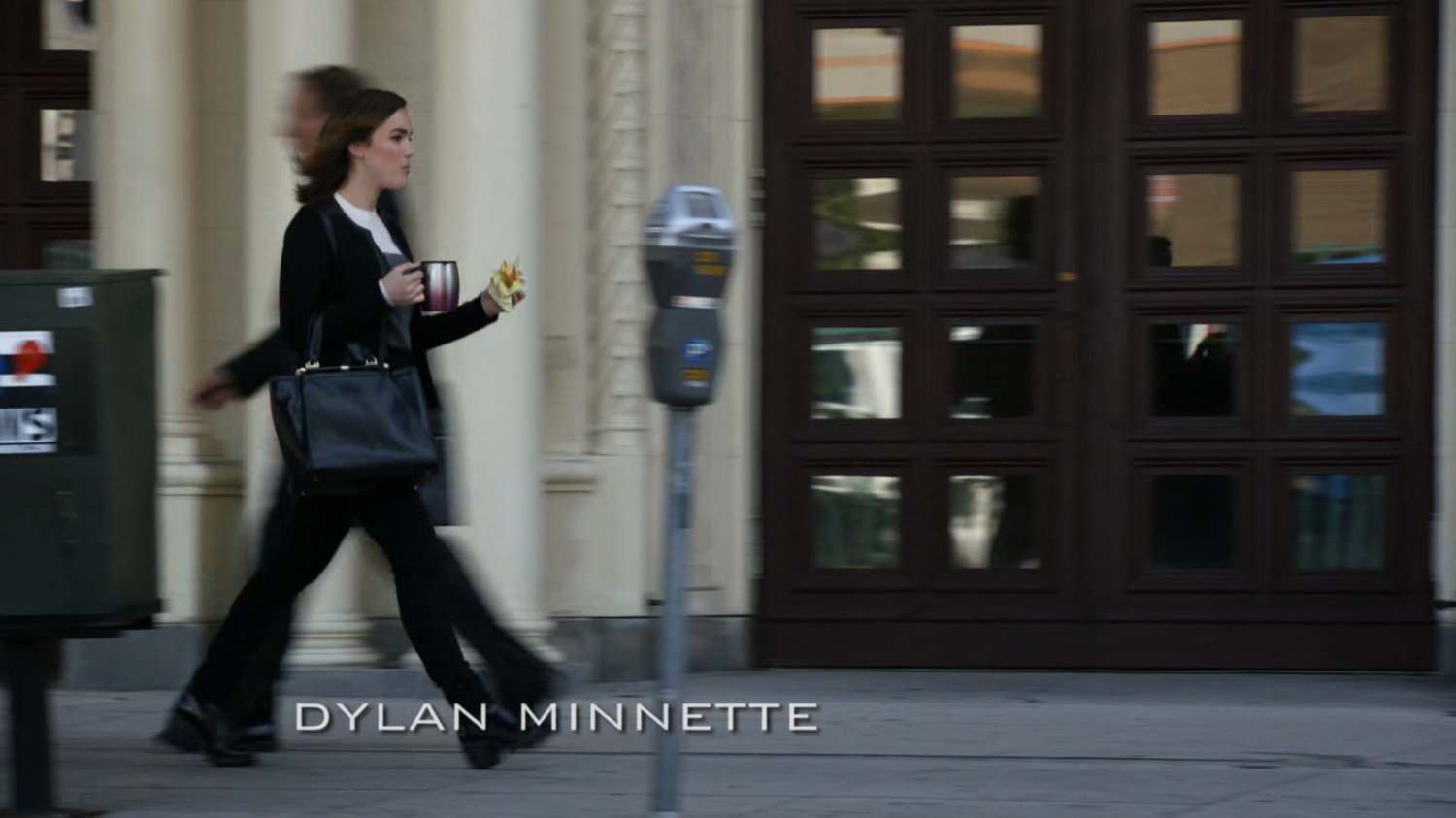 Jemma walks past a building on her way to work.