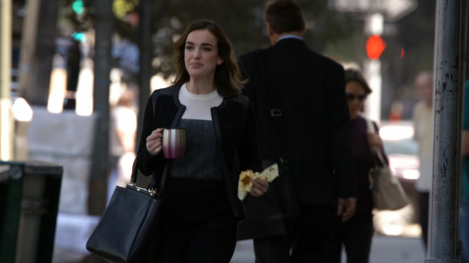 Jemma walks to work on a city street.