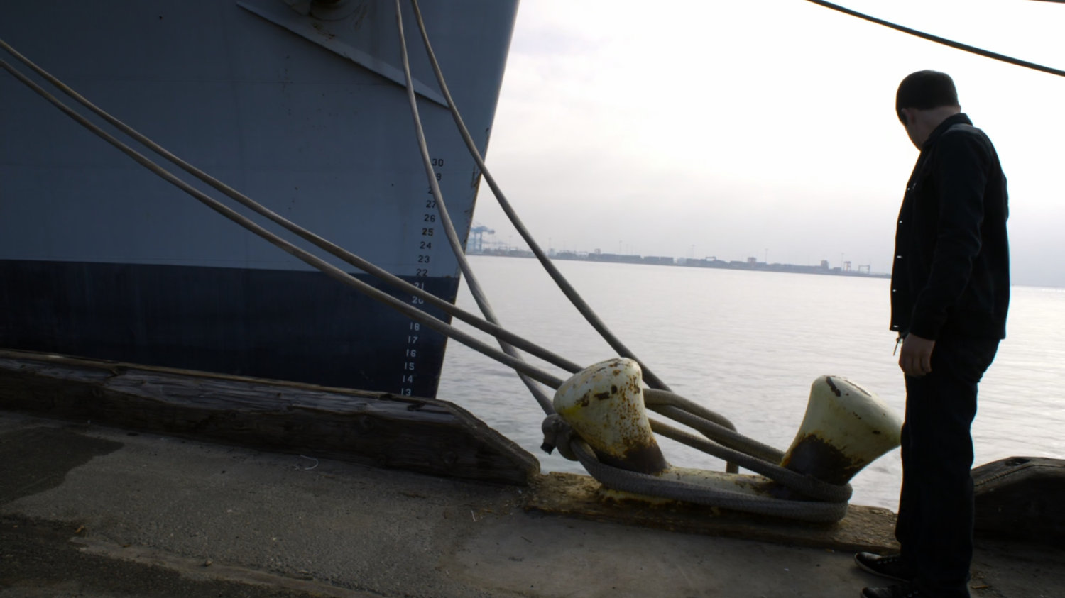 Donnie Gill on dock next to ship.
