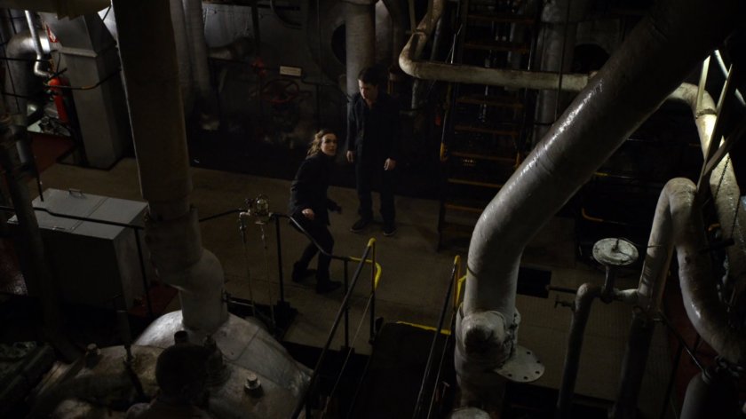 Simmons and Donnie Gill in the engine room of a ship.