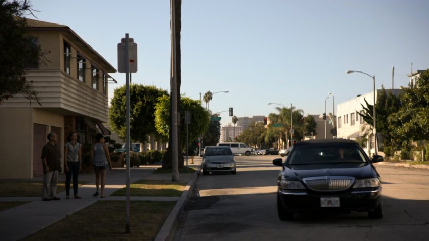 A black sedan pulls up outside a Miami church.