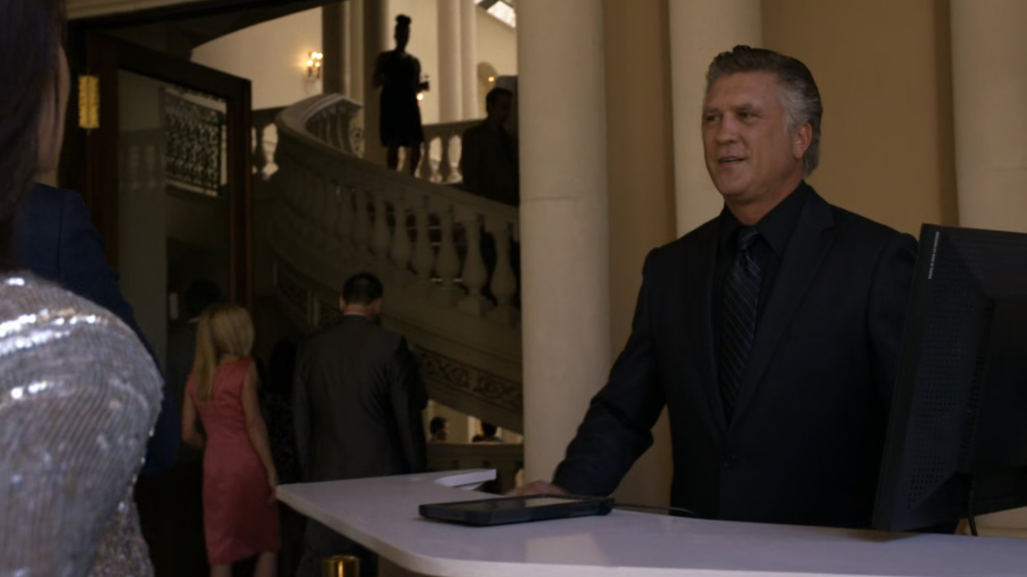 Security desk and interior of Miami mansion.