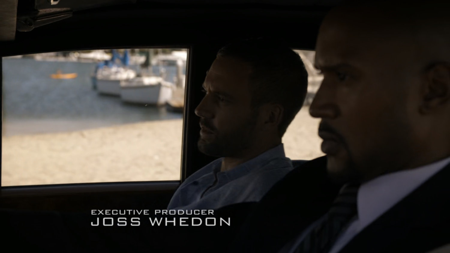 Mack and Hunter in car by beach.