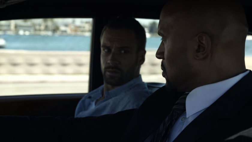 Mack and Hunter in car by beach.