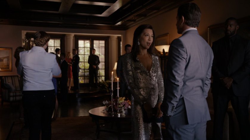 May talking to guests at Miami mansion.