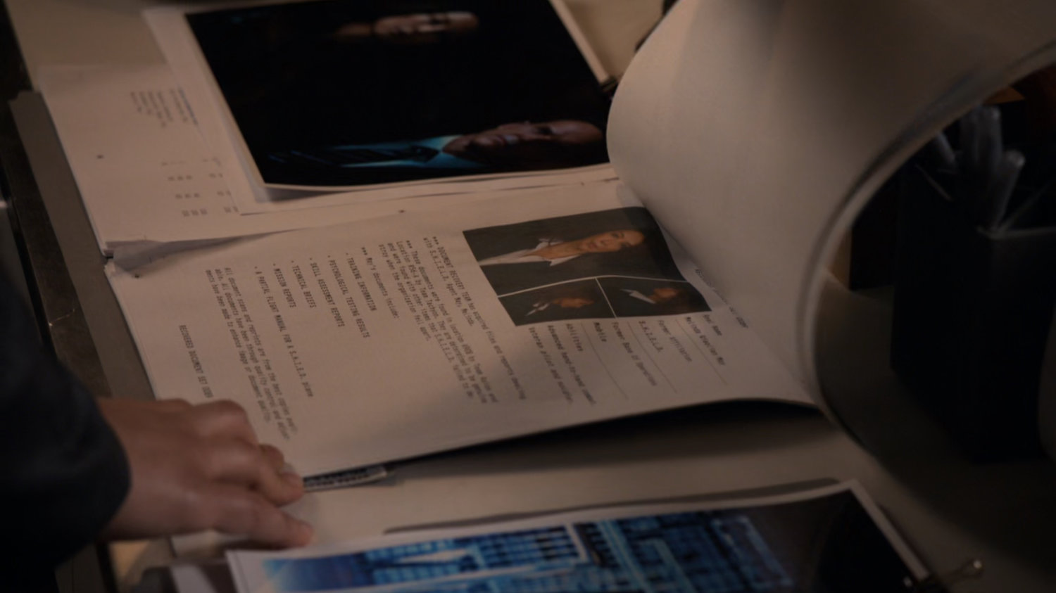 Closeup of Agent May dossier.