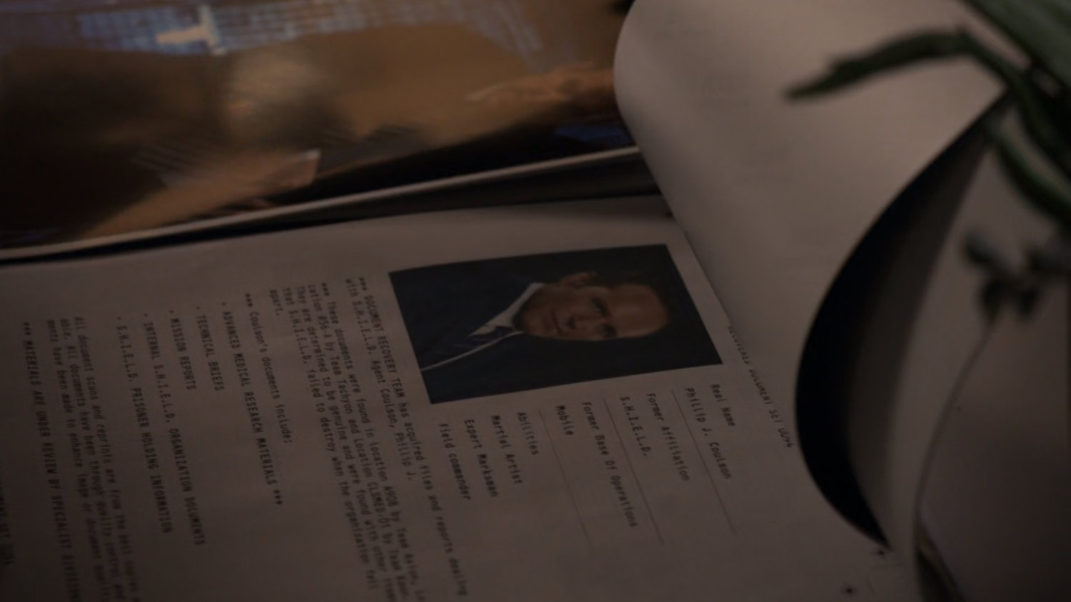 Closeup of Agent Coulson dossier.