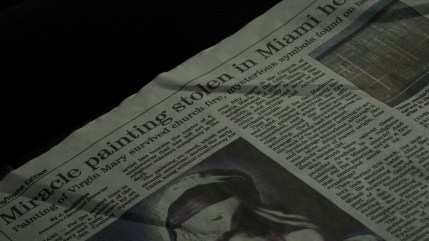 Closeup of newspaper story on church fire.