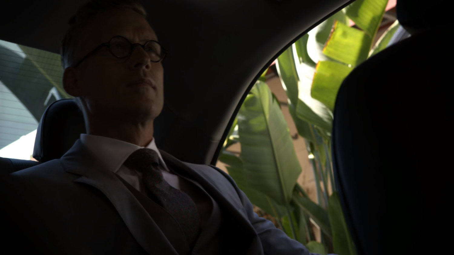 Daniel Whitehall in back seat of Raina's car.