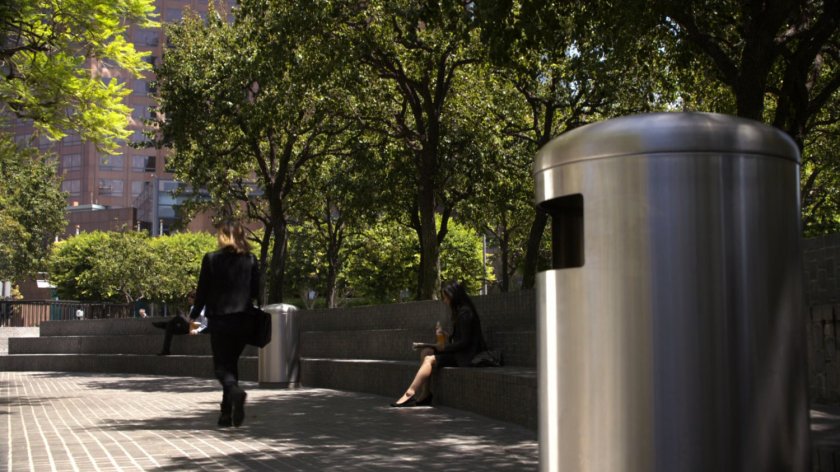 Simmons walking away from a trash can in a park.