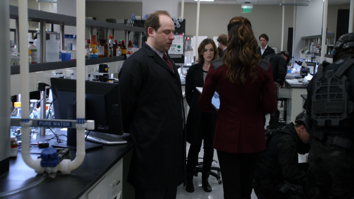 Simmons and her supervisor being questioned by Bobbi inside the HYDRA laboratory.