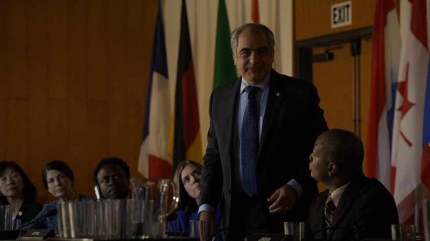 A man standing at the table in the United Nations.