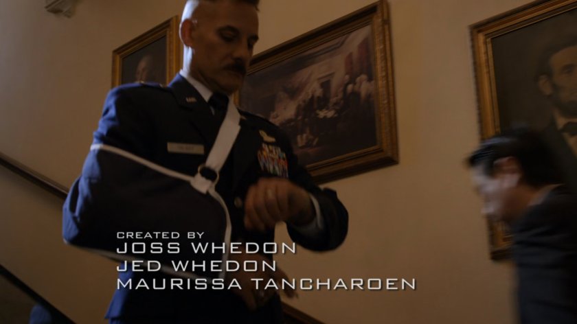 General Talbot descending stair wearing sling.