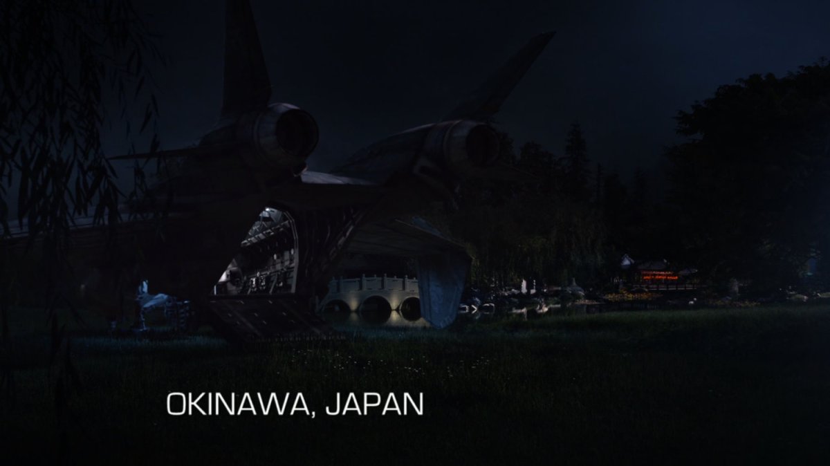 Quinjet parked by Japanese shrine. Text: Okinawa, Japan.