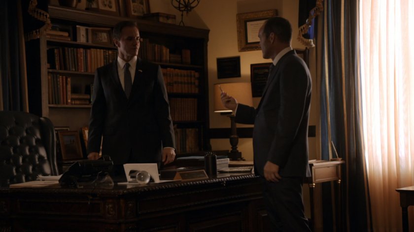 Coulson talking to Senator Ward in his office.