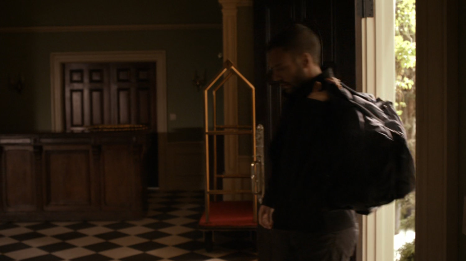 Hunter enters safe house.