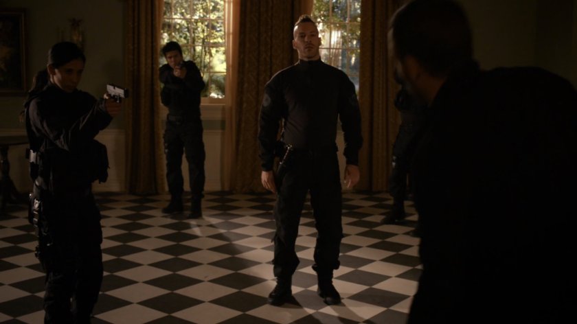 Hunter confronts HYDRA agents in Safe House foyer.