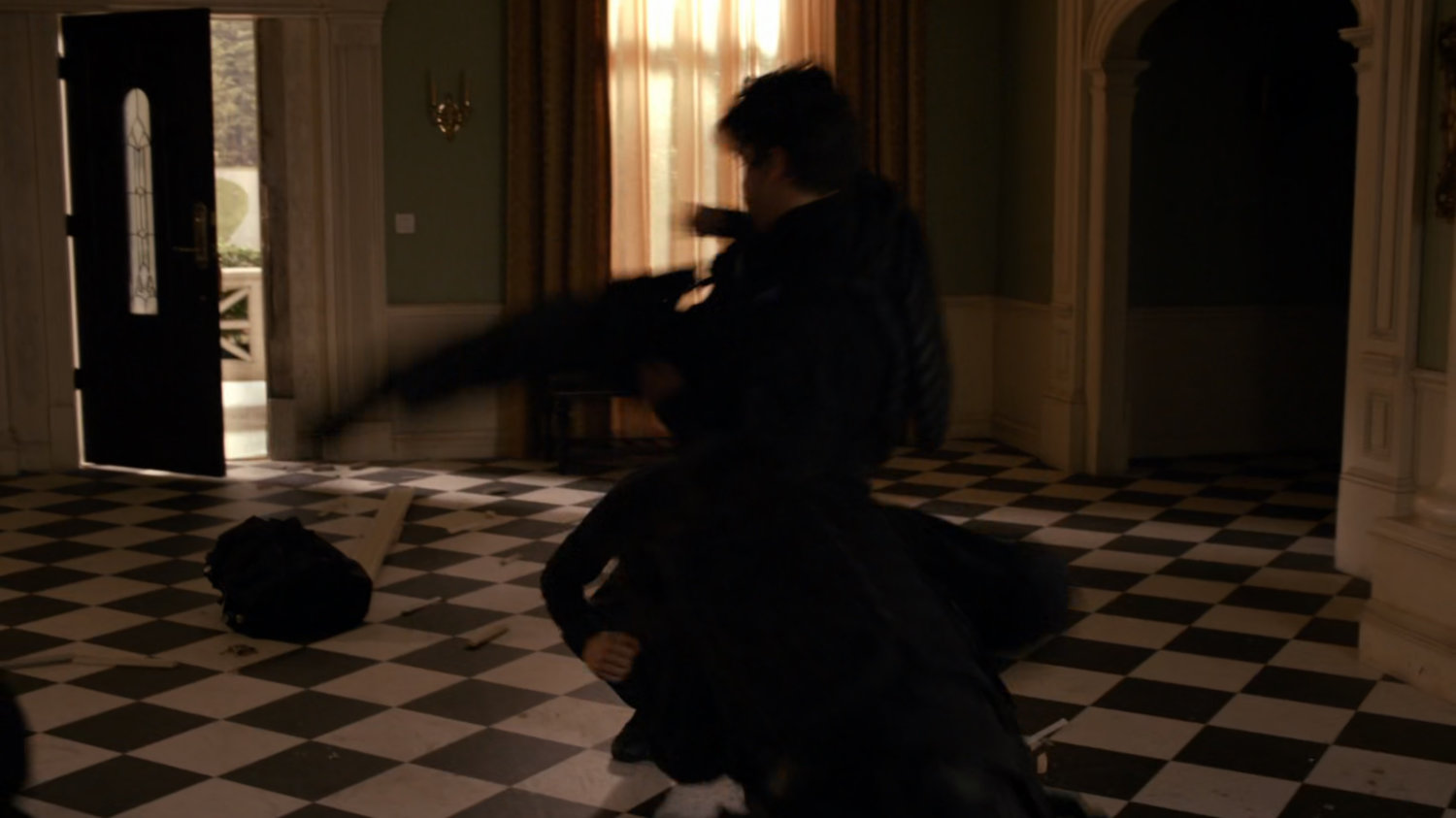 A fight in a safe house foyer.