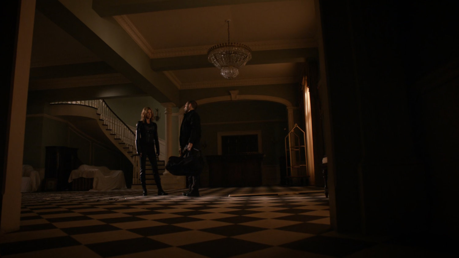 Bobbi and Hunter in safe house foyer.