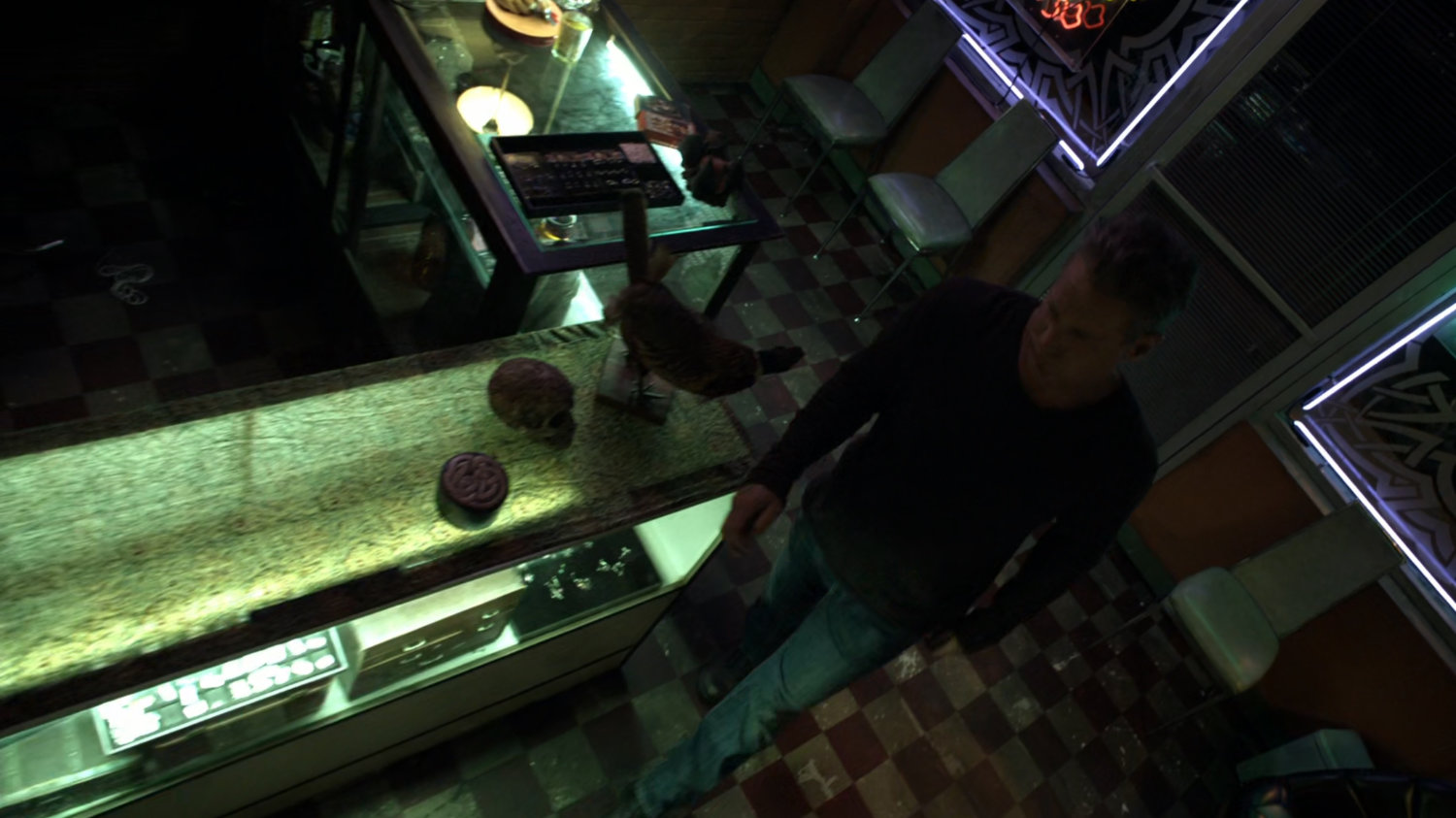 Sebastian Derik enters Tattoo shop.