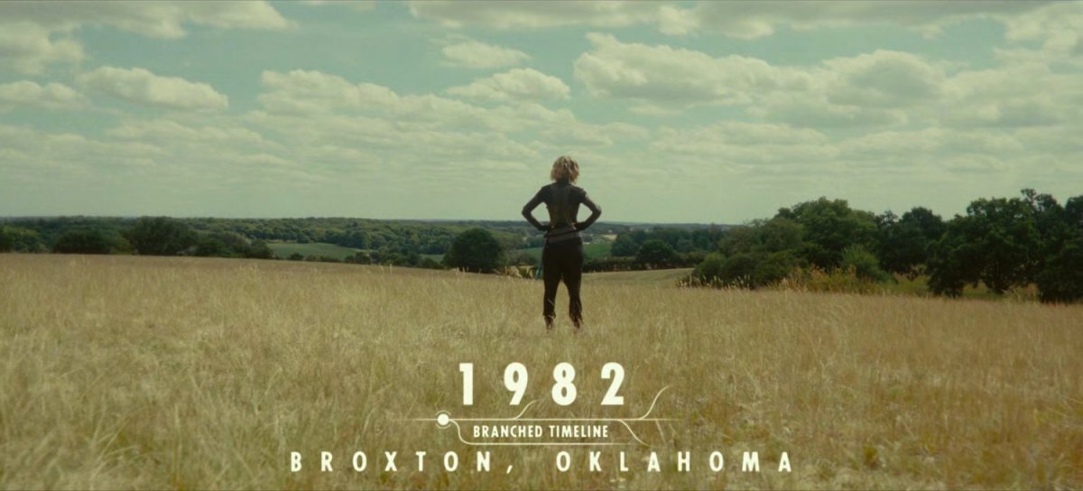 Sylvie standing in a field in Broxton, Oklahoma. Text: 1982, Branched Timeline, Broxton, Oklahoma.