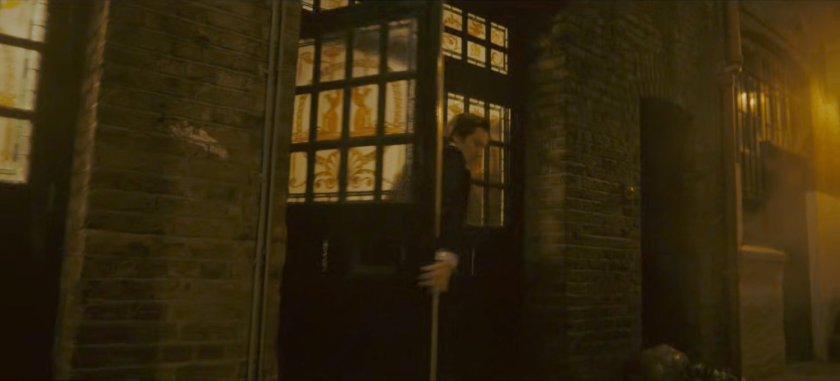 Brad exits the theater into a dark alley.