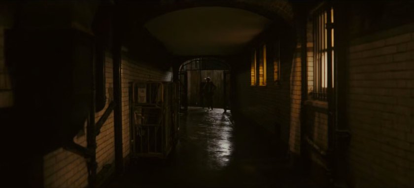 A dark London alley.