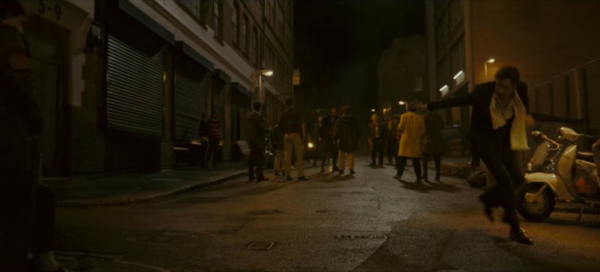 Brad on a dark London street.