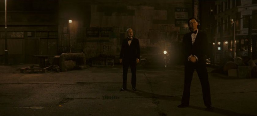 Loki and Mobius in dark abandoned lot.