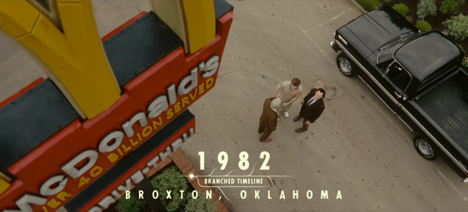 High angle outside McDonald's. Text: 1982, Branched Timeline, Broxton, Oklahoma.