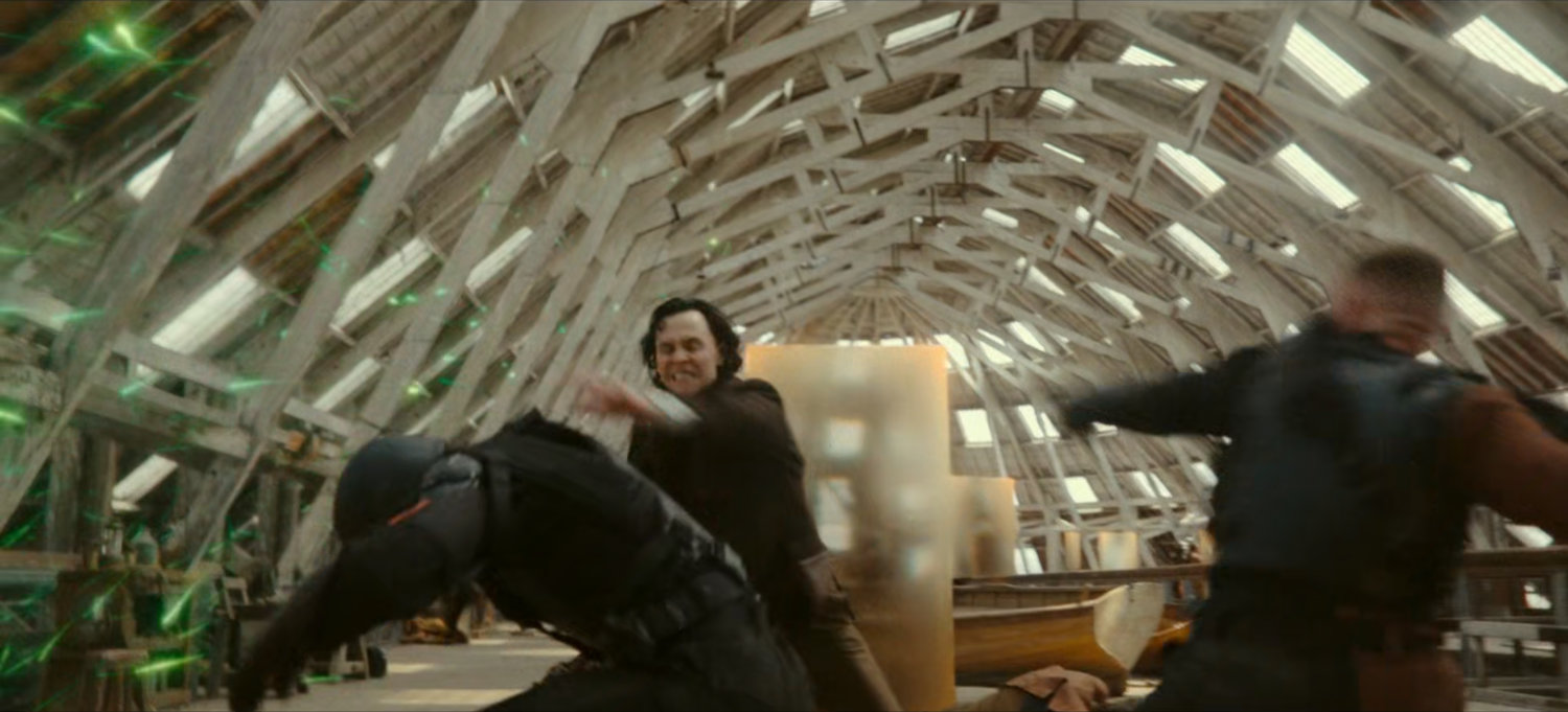 Loki fights TVA Hunters inside boatbuilders.