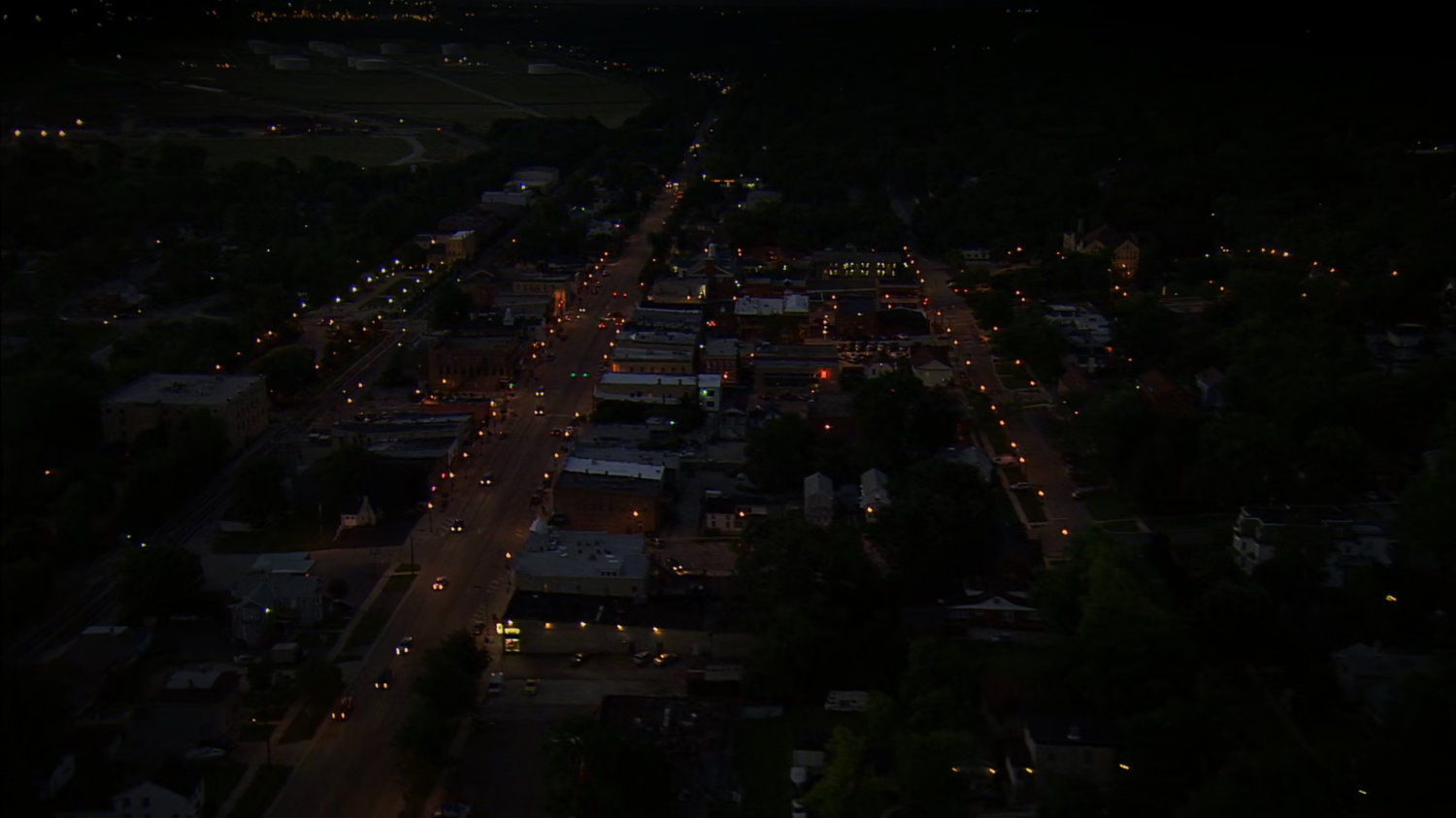 Aerial nighttime shot of town.