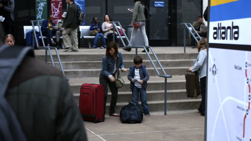 Grant Ward watching mother and son outside Atlanta bus terminal.