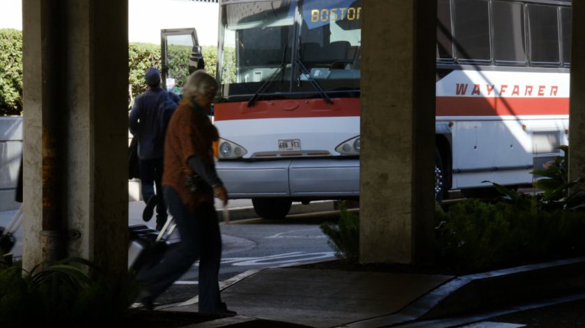 Bus labeled for Boston outside Atlanta bus terminal.