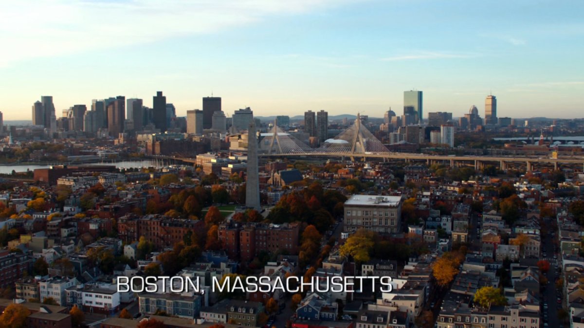 Aerial of Boston. Text: Boston, Massachusetts.