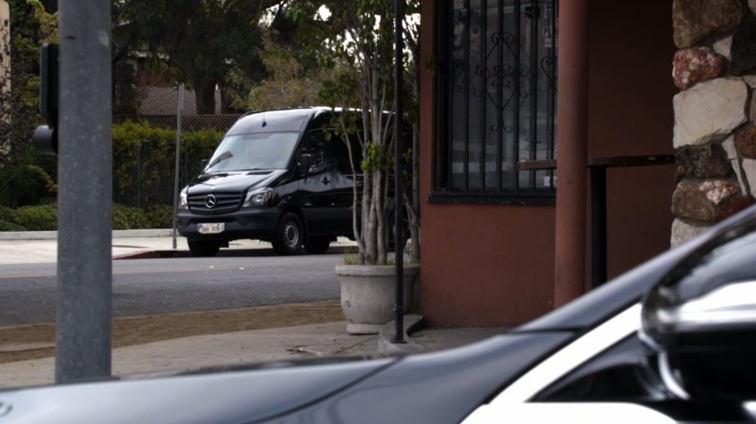 Black van across corner from Goldbrix Tavern.