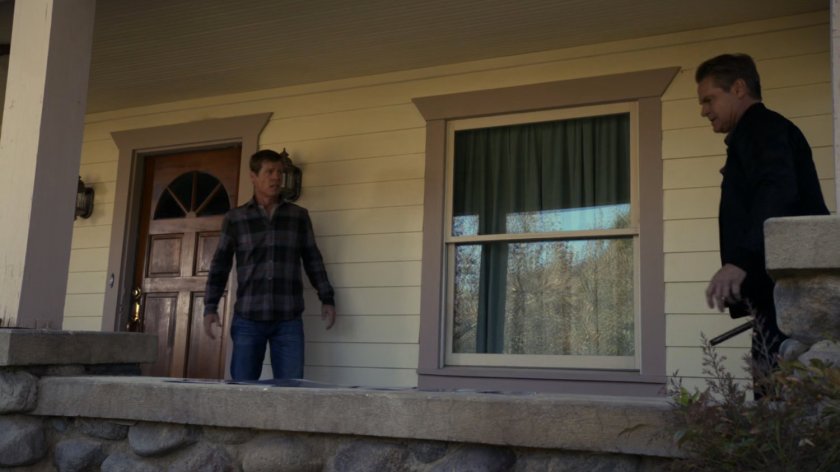 Hank Thompson and Sebastian Derik on a porch of a house.