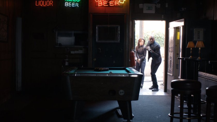 May and Triplett enter Goldbrix Tavern.