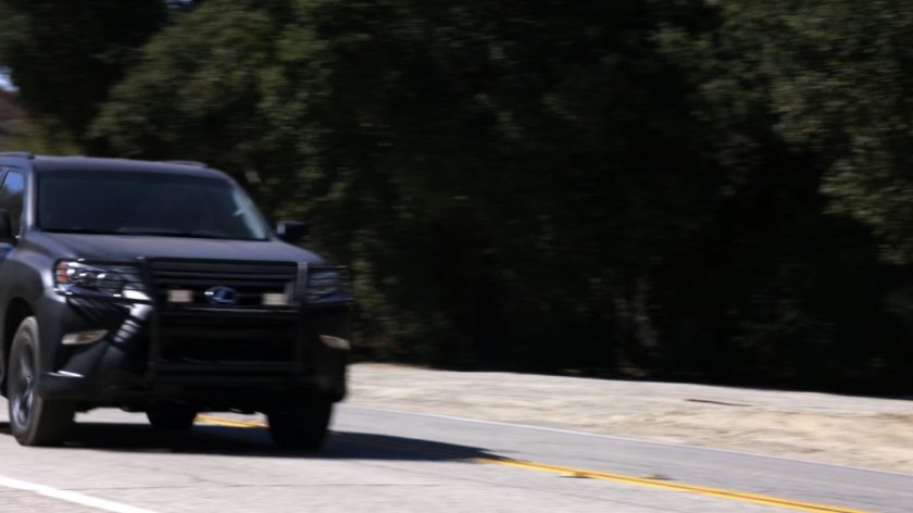 SHIELD SUV on a rural highway outside Hank Thompson's house.