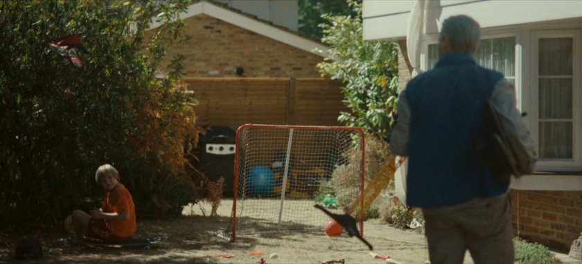Don talking to his son outside his house.