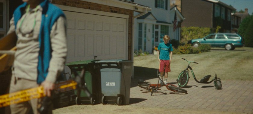 Don's son in driveway of their house.