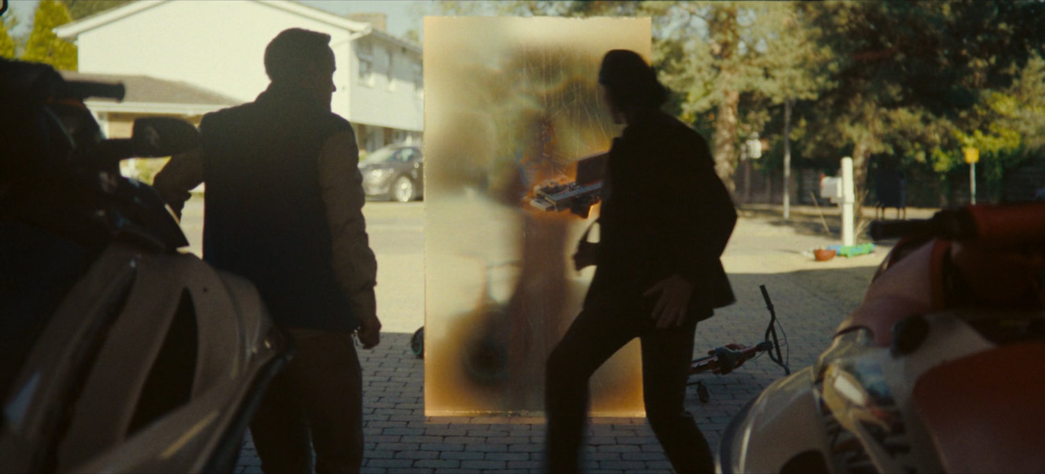 A time door appears behind Loki and Don at his house.