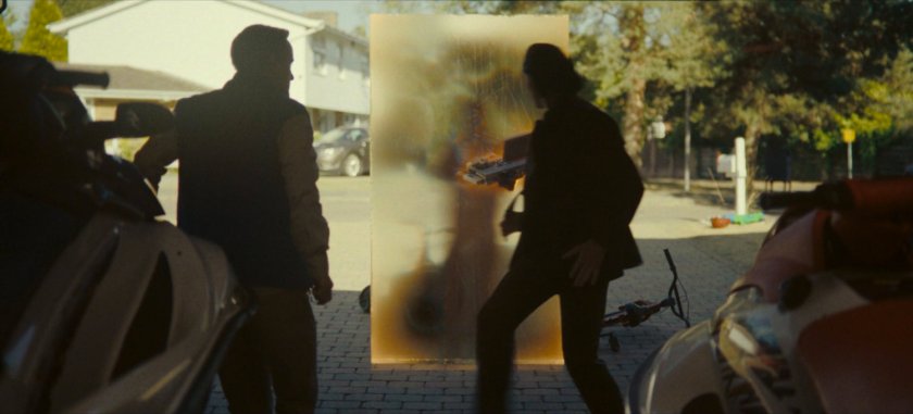 A time door appears behind Loki and Don at his house.