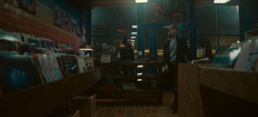 Sylvie enters Broxton record store.
