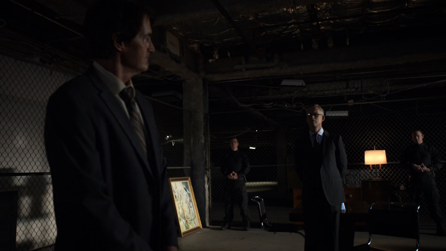 Calvin Zabo and Daniel Whitehall inside a HYDRA warehouse/bunker.