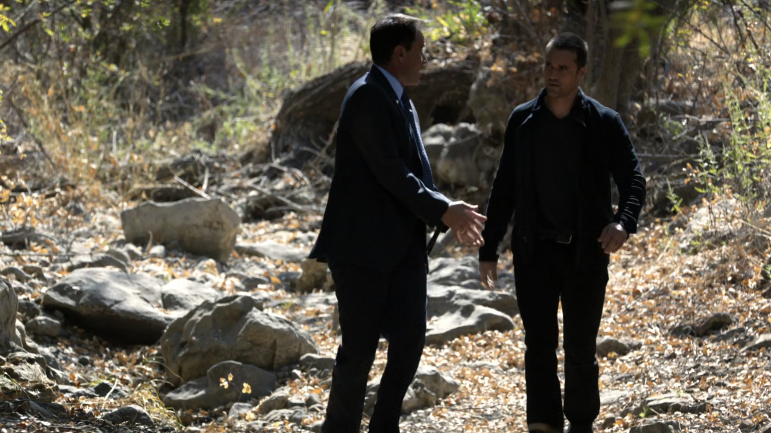 Grant Ward walks Christian Ward through the Massachusetts woods as a prisoner.