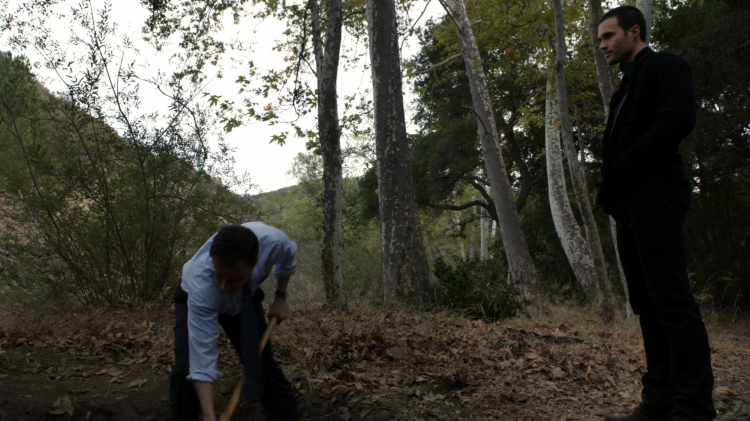 Christian Ward digs a hole in the Massachusetts woods, while Grant Ward watches.